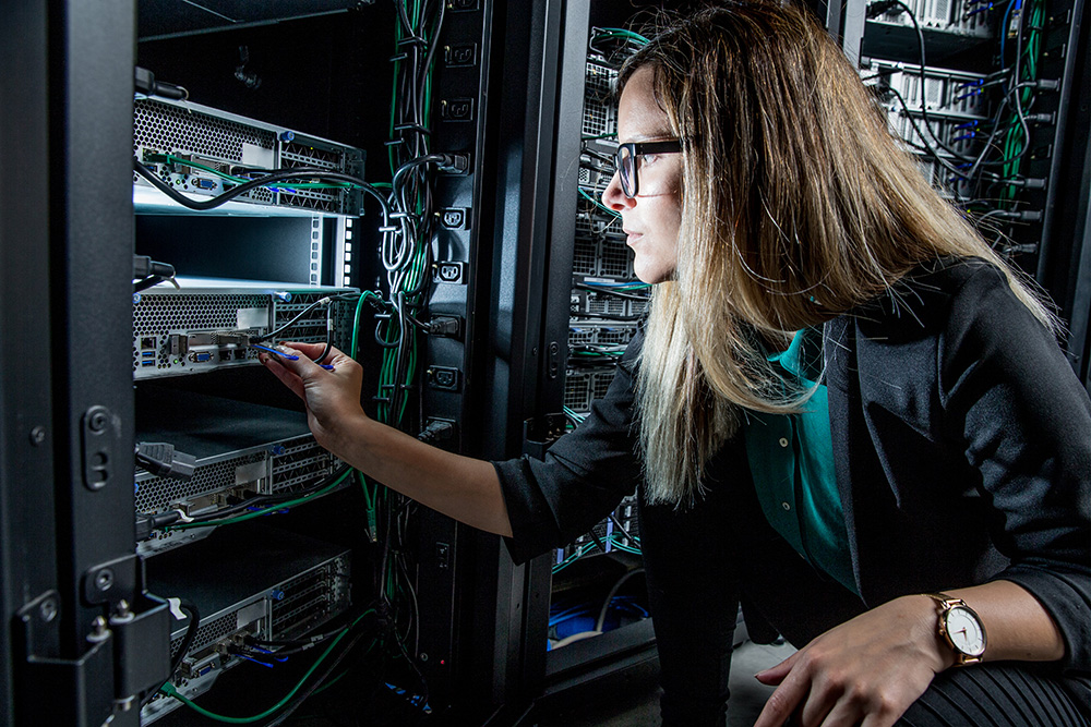 Columbia Data Analytics. Why Choose Us: Computer Power. IT Engineer Working in Server Room.